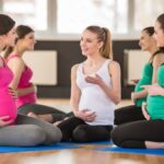 Prenatal yoga instructor instructing group of Pregnancy women